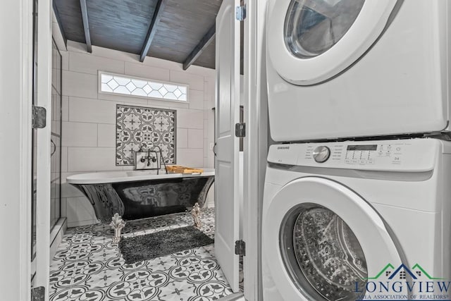 718 Pine St, Gilmer, TX 75644 - laundry room with wood ceiling, laundry area, stacked washing maching and dryer, tile walls, and tile patterned flooring