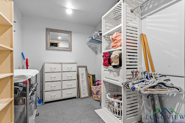 718 Pine St, Gilmer, TX 75644 - spacious closet featuring carpet flooring