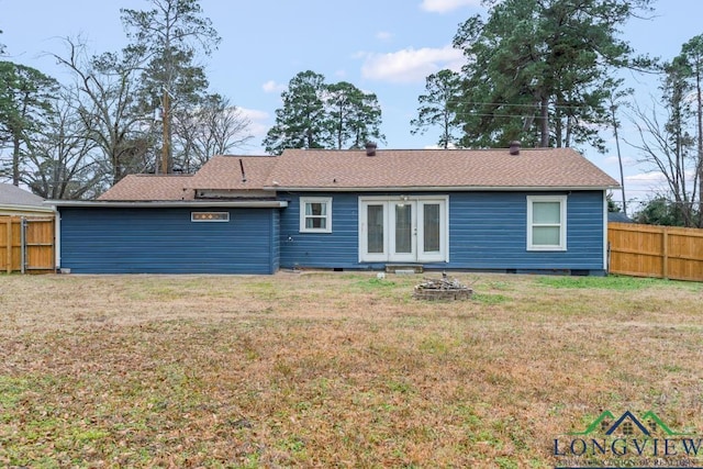 718 Pine St, Gilmer, TX 75644 - rear view of property featuring a yard, an outdoor fire pit, fence, and french doors