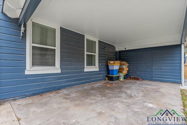 718 Pine St, Gilmer, TX 75644 - view of patio / terrace featuring an attached carport