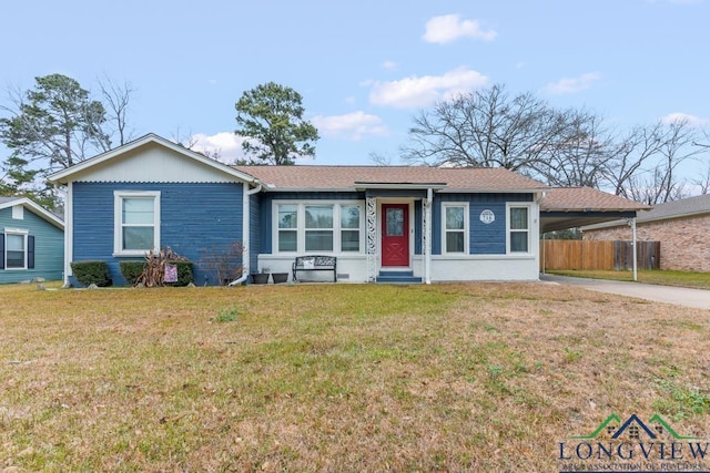 718 Pine St, Gilmer, TX 75644 - ranch-style house featuring driveway, fence, entry steps, an attached carport, and a front lawn