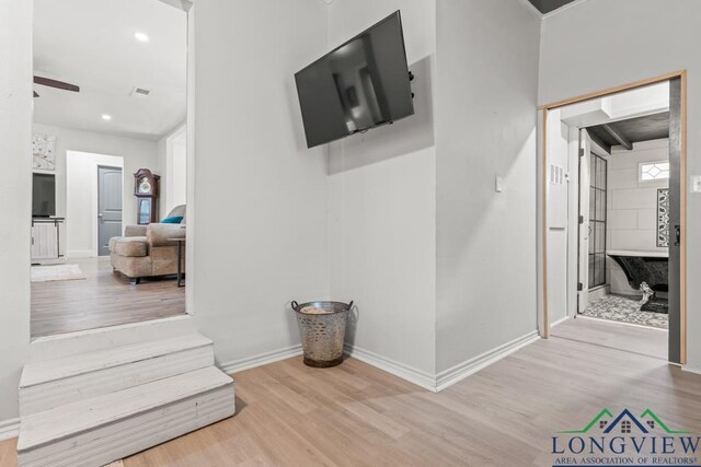 718 Pine St, Gilmer, TX 75644 - hallway featuring visible vents, wood finished floors, baseboards, and recessed lighting