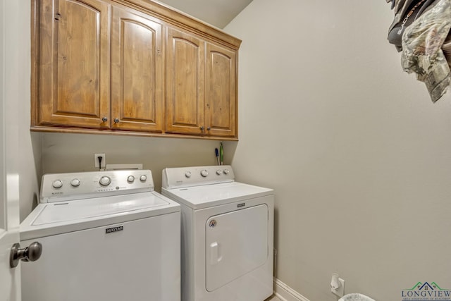 220 Cedar Rdg, Longview, TX 75602 - laundry area with cabinet space, baseboards, and washer and dryer
