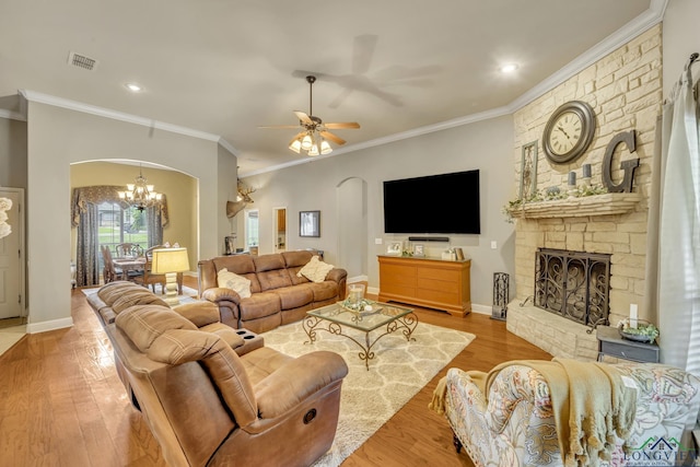 220 Cedar Rdg, Longview, TX 75602 - living room with visible vents, arched walkways, a fireplace, wood finished floors, and ornamental molding