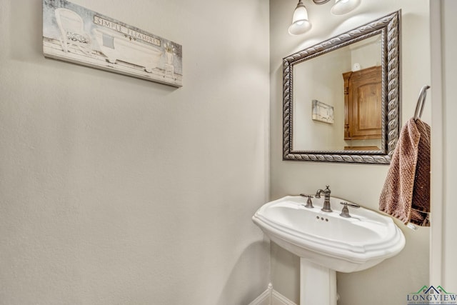 220 Cedar Rdg, Longview, TX 75602 - bathroom with a sink and baseboards