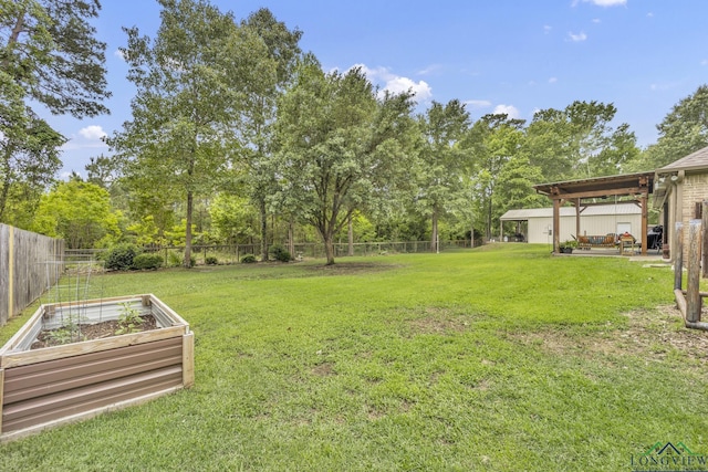 220 Cedar Rdg, Longview, TX 75602 - view of yard featuring a fenced backyard, a patio area, and a vegetable garden