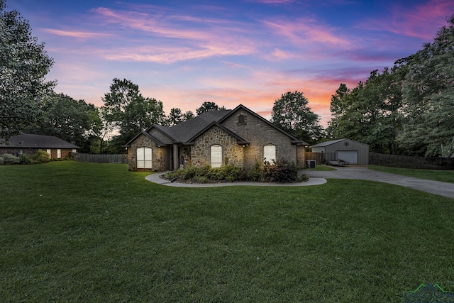 220 Cedar Rdg, Longview, TX 75602 - french country style house featuring fence, a detached garage, a front yard, an outbuilding, and concrete driveway