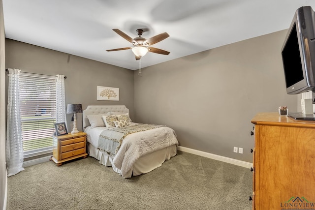 220 Cedar Rdg, Longview, TX 75602 - bedroom with baseboards, a ceiling fan, and carpet