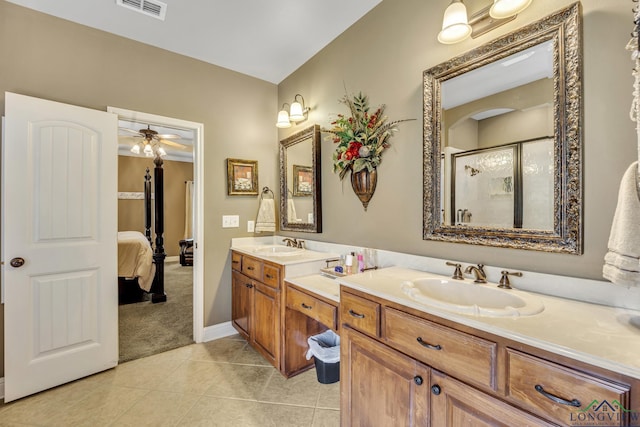 220 Cedar Rdg, Longview, TX 75602 - ensuite bathroom with double vanity, visible vents, a shower stall, and a sink
