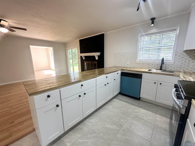 3401 Cooper Ln, Texarkana, TX 75503 - kitchen with dishwasher, a sink, a peninsula, range with gas stovetop, and a ceiling fan