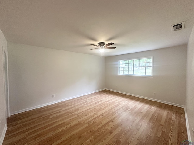 3401 Cooper Ln, Texarkana, TX 75503 - spare room with ceiling fan, wood finished floors, and baseboards