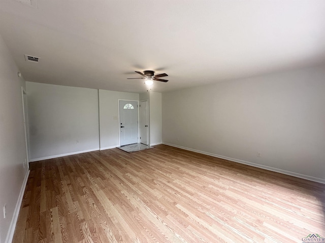 3401 Cooper Ln, Texarkana, TX 75503 - spare room with wood finished floors, a ceiling fan, and baseboards