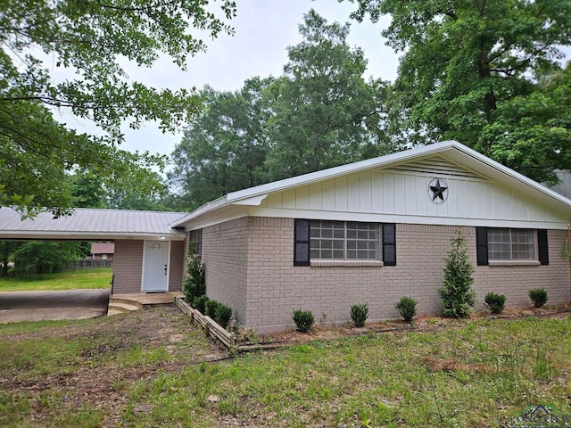 3401 Cooper Ln, Texarkana, TX 75503 - ranch-style house with brick siding, a carport, and a front yard