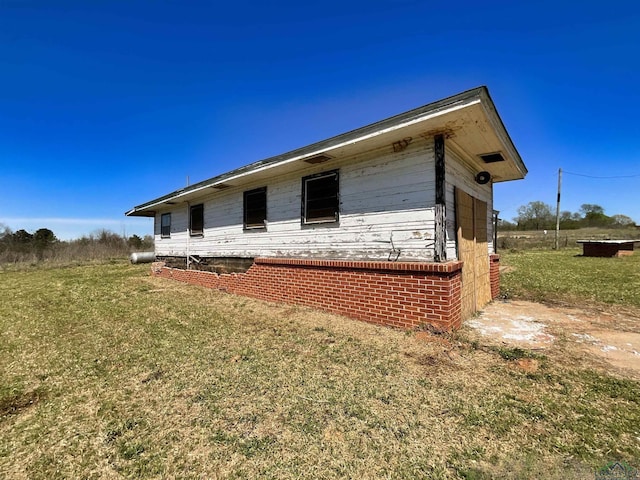 view of property exterior with a yard