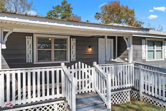 entrance to property with a porch