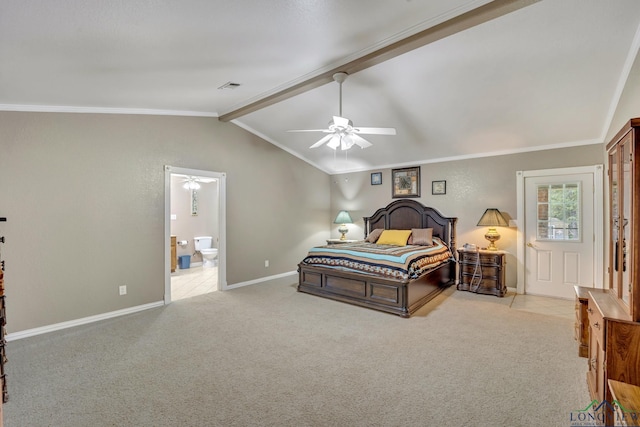 carpeted bedroom featuring ceiling fan, lofted ceiling with beams, ornamental molding, and connected bathroom