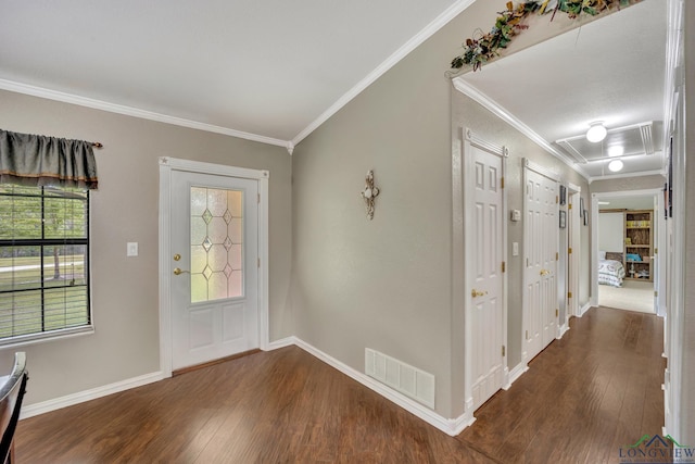 entrance foyer with dark hardwood / wood-style flooring and crown molding