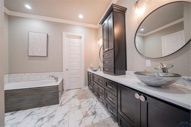 bathroom featuring vanity, crown molding, and tiled tub