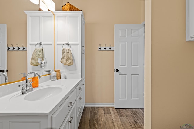 bathroom with vanity and hardwood / wood-style floors