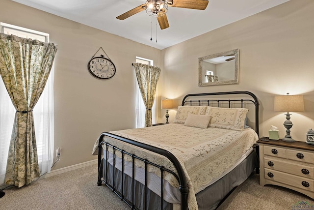 bedroom with ceiling fan and carpet flooring