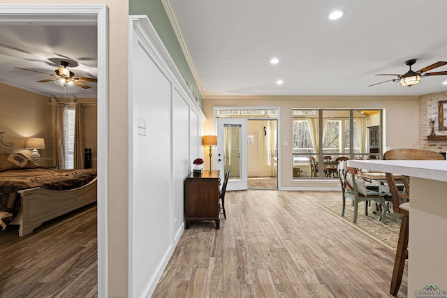 corridor featuring hardwood / wood-style flooring, french doors, and ornamental molding