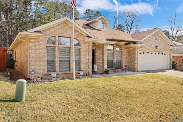 view of front of property with a garage and a front lawn