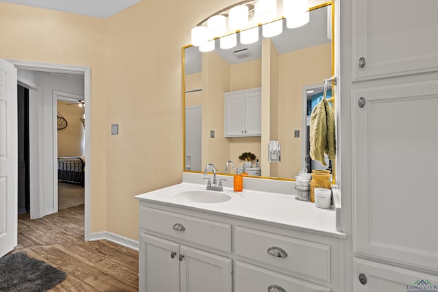 bathroom featuring hardwood / wood-style flooring and vanity