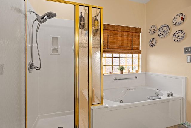 bathroom with shower with separate bathtub