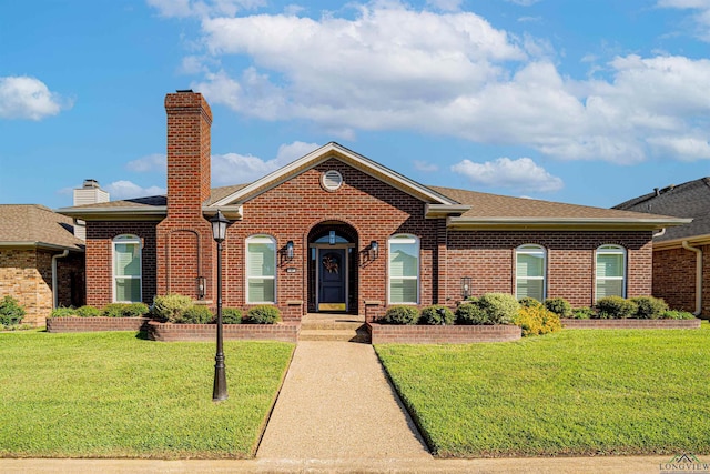 single story home featuring a front yard