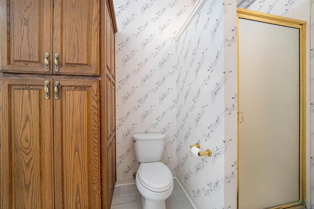 bathroom with toilet and walk in shower