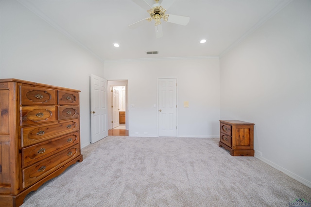 carpeted bedroom featuring ceiling fan and ornamental molding