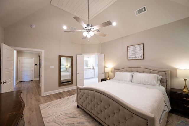 bedroom featuring baseboards, visible vents, a ceiling fan, light wood-type flooring, and high vaulted ceiling