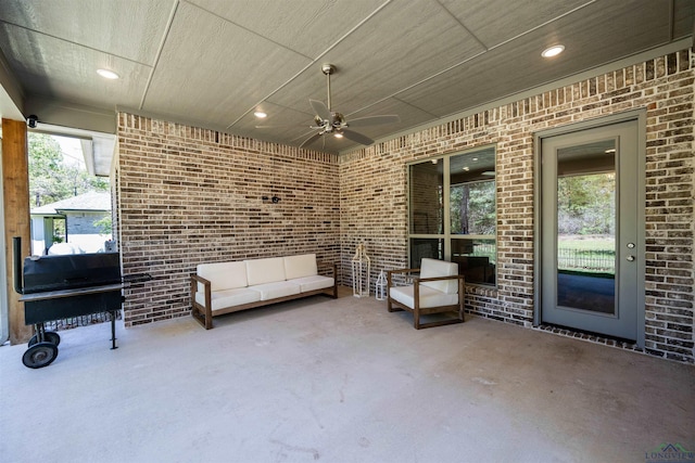 view of patio with ceiling fan and an outdoor hangout area