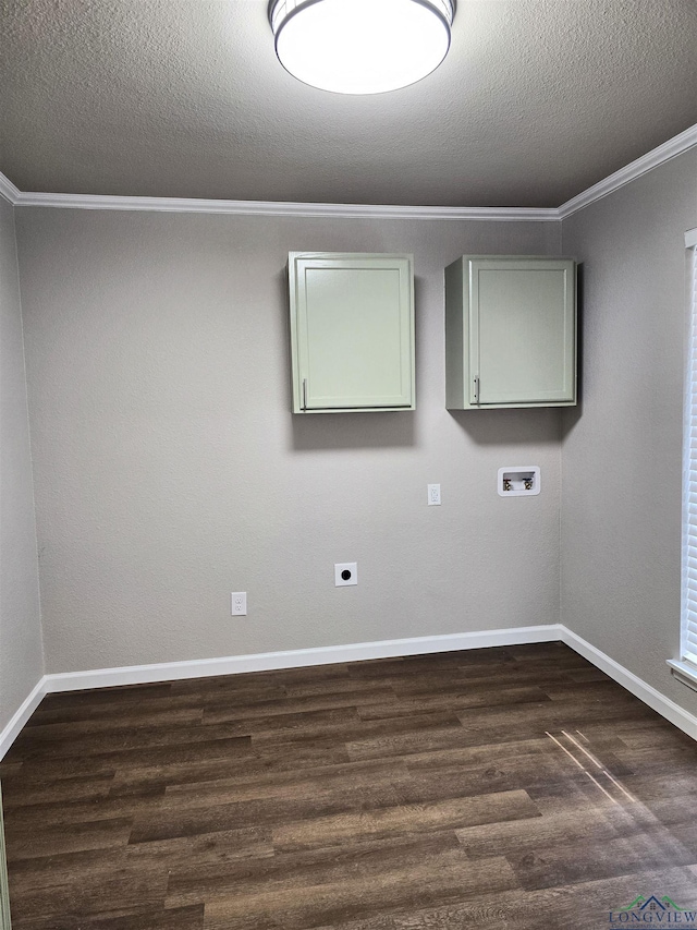 2013 E Warwick Cir, Longview, TX 75601 - empty room featuring ornamental molding, dark wood-style flooring, and a textured ceiling