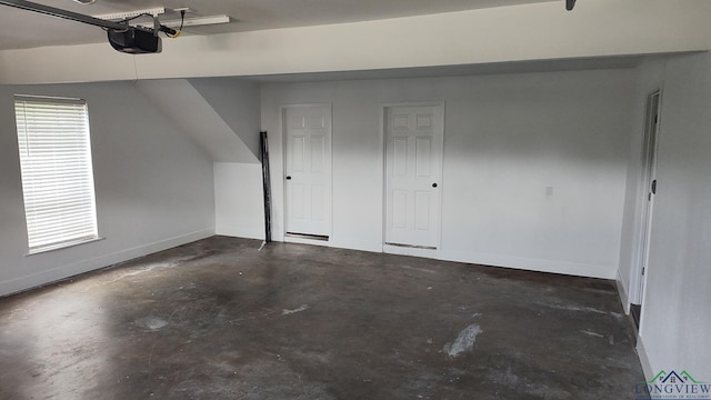 2013 E Warwick Cir, Longview, TX 75601 - garage with baseboards and a garage door opener