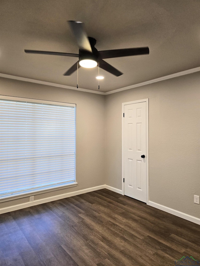 2013 E Warwick Cir, Longview, TX 75601 - empty room featuring ceiling fan and dark wood-style floors