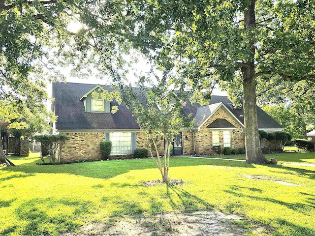 2013 E Warwick Cir, Longview, TX 75601 - view of front of property featuring brick siding and a front yard