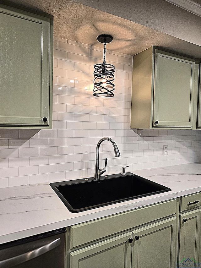 2013 E Warwick Cir, Longview, TX 75601 - kitchen with green cabinets, dishwasher, tasteful backsplash, light countertops, and a textured ceiling