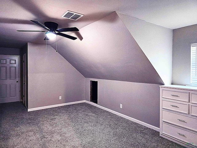 2013 E Warwick Cir, Longview, TX 75601 - bonus room with a ceiling fan, dark colored carpet, lofted ceiling, and a textured ceiling