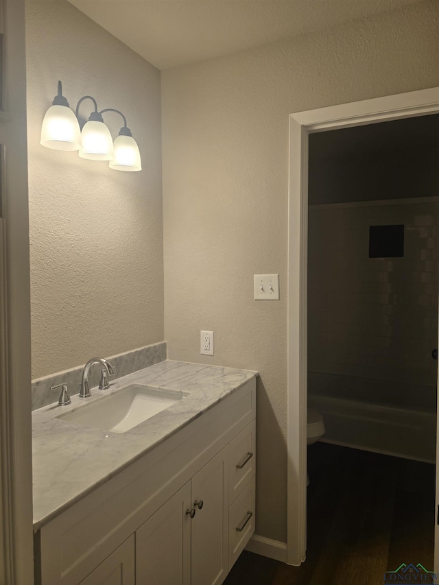 2013 E Warwick Cir, Longview, TX 75601 - bathroom featuring vanity and wood finished floors