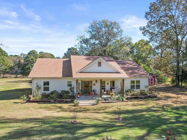 view of front of home with a porch and a front lawn