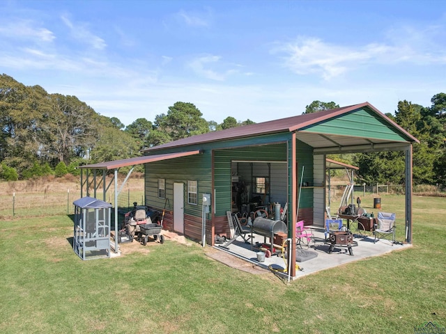 view of outbuilding with a yard