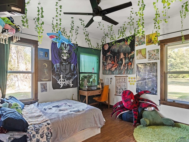 bedroom with hardwood / wood-style floors and ceiling fan