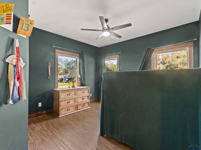 bedroom featuring dark hardwood / wood-style flooring and ceiling fan