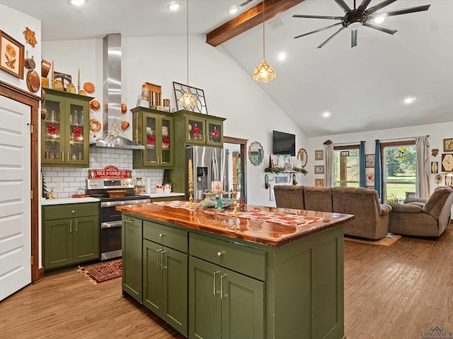 kitchen featuring backsplash, wall chimney exhaust hood, stainless steel appliances, beamed ceiling, and a center island