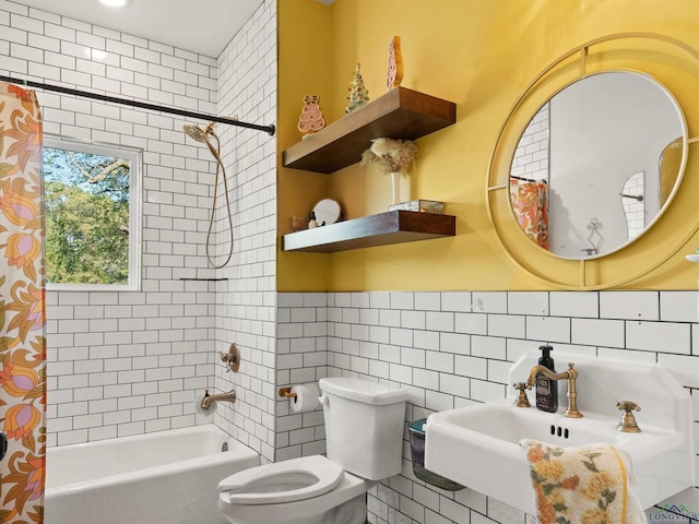 full bathroom featuring tile walls, sink, shower / bath combo, and toilet