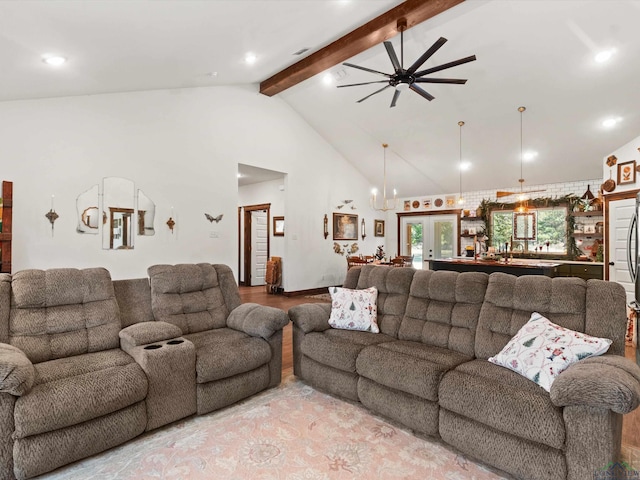 living room featuring beam ceiling, ceiling fan, french doors, and high vaulted ceiling