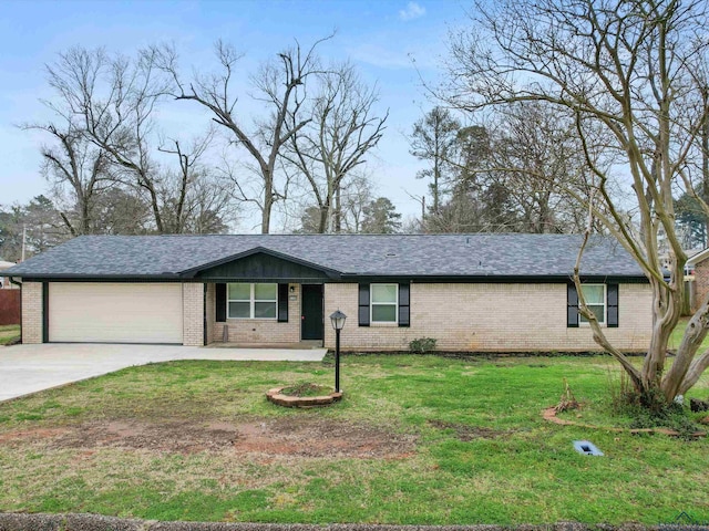 single story home featuring driveway, a shingled roof, a front yard, an attached garage, and brick siding