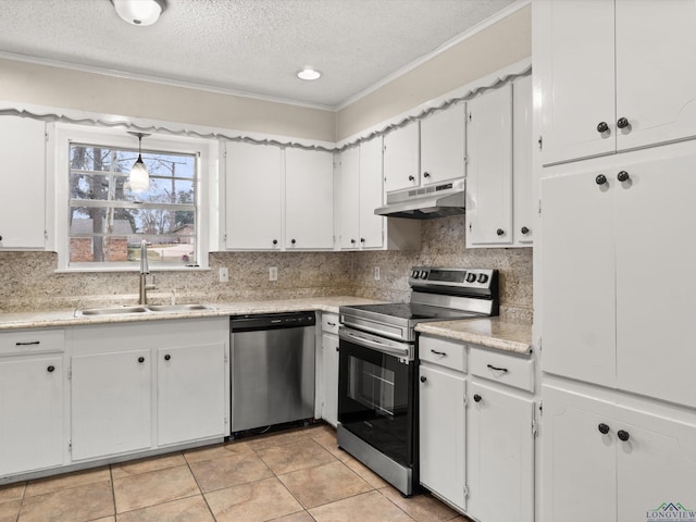 kitchen with under cabinet range hood, stainless steel appliances, white cabinets, and a sink