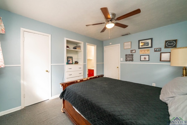 carpeted bedroom featuring visible vents and a ceiling fan